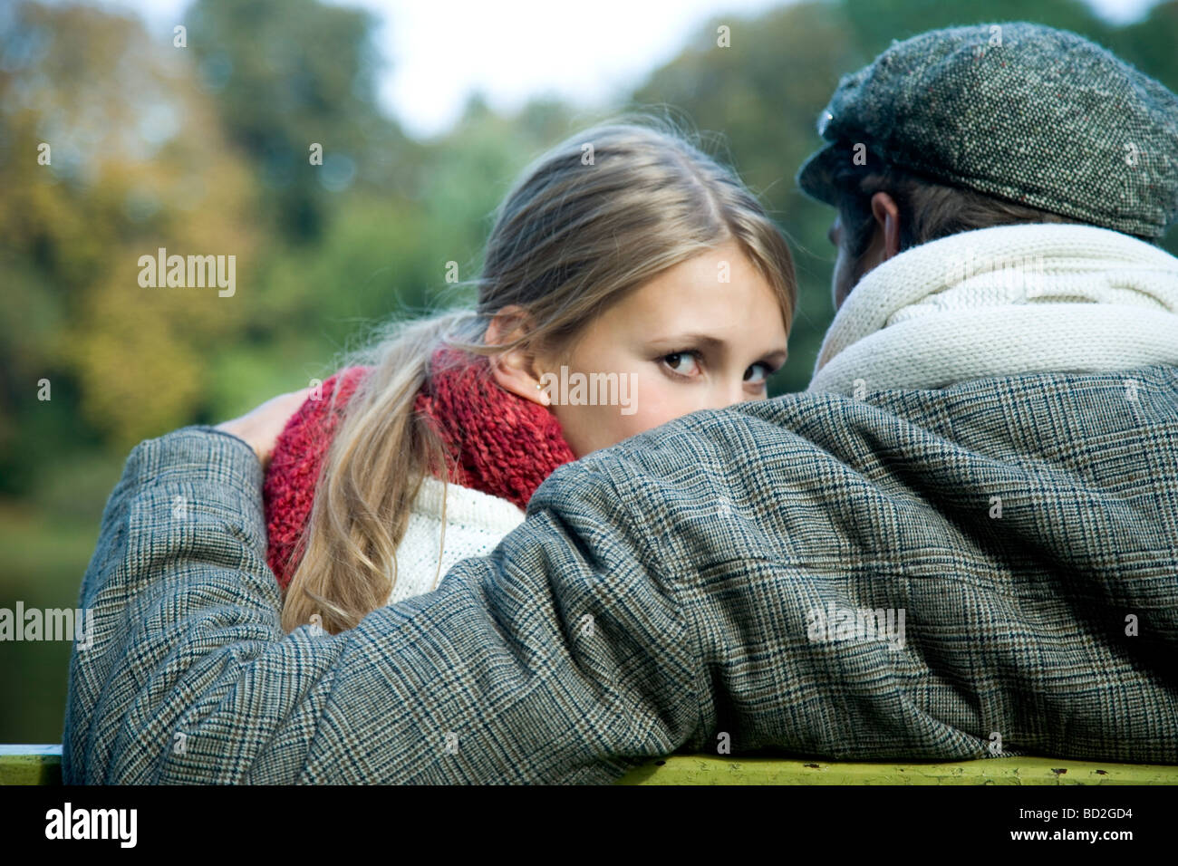 Couple hugging in park Stock Photo - Alamy