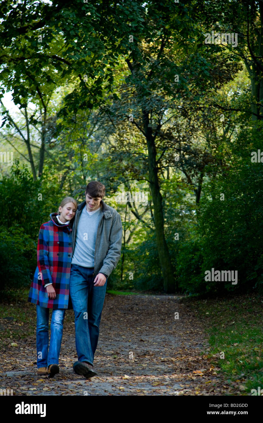 Couple hugging in park Stock Photo - Alamy