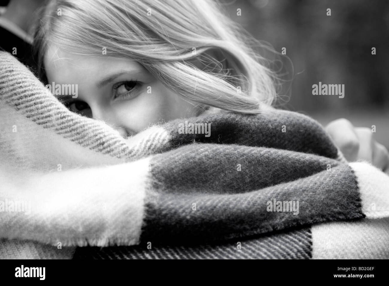 Couple wrapped in blanket Stock Photo