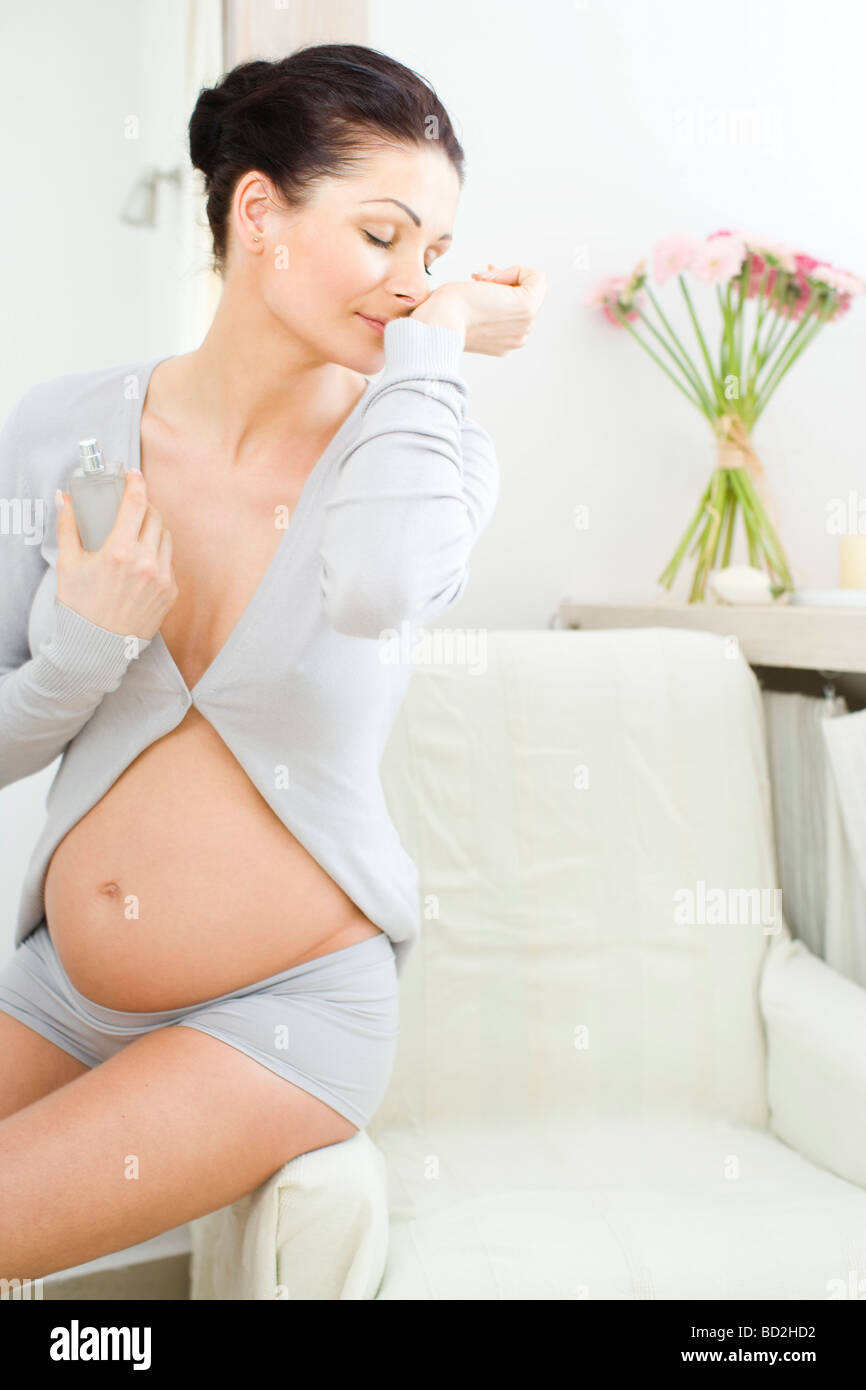 Pregnant woman with perfume Stock Photo Alamy