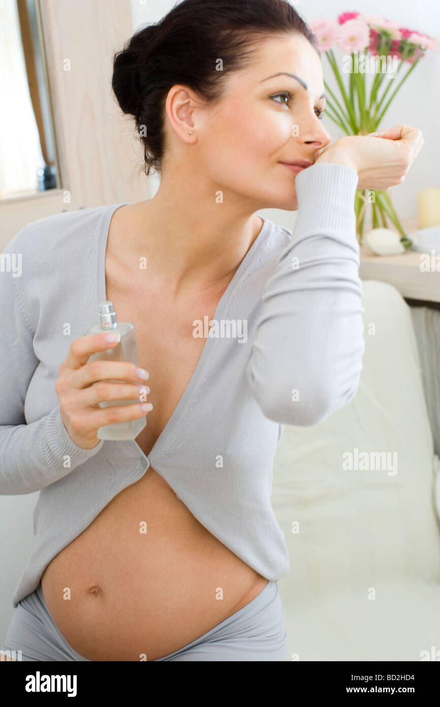 Pregnant woman with perfumes Stock Photo Alamy