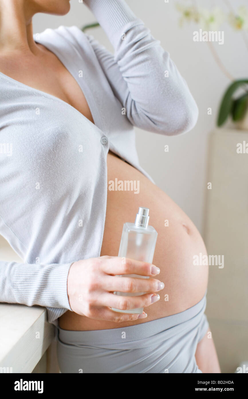 Pregnant woman with perfume Stock Photo Alamy