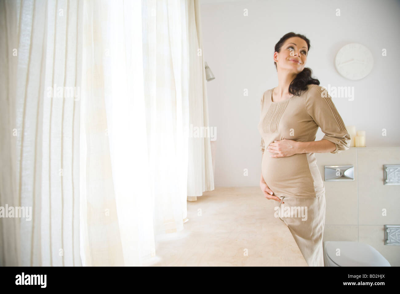 Pregnant woman in bathroom Stock Photo Alamy