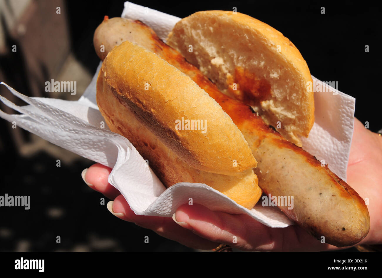 Hot dog or Bratwurst sausage in a bread roll Stock Photo