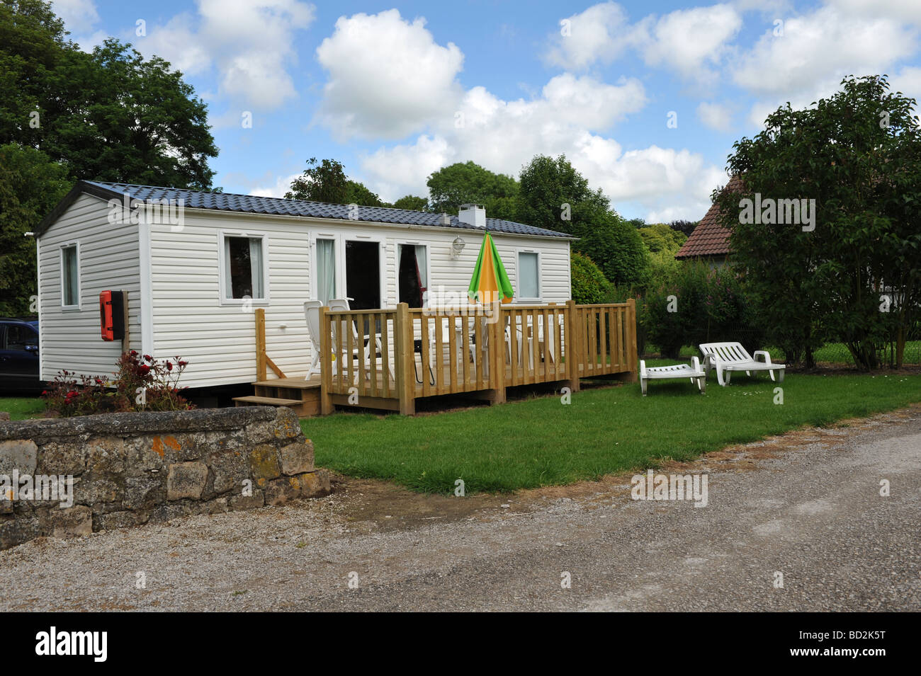 Large family static caravan or mobile home on a well tended and peaceful camp ground Stock Photo
