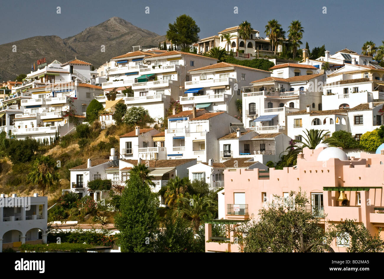 Villas on the hillside above Playa Burriana Beach in Nerja Costa del Sol Spain Stock Photo