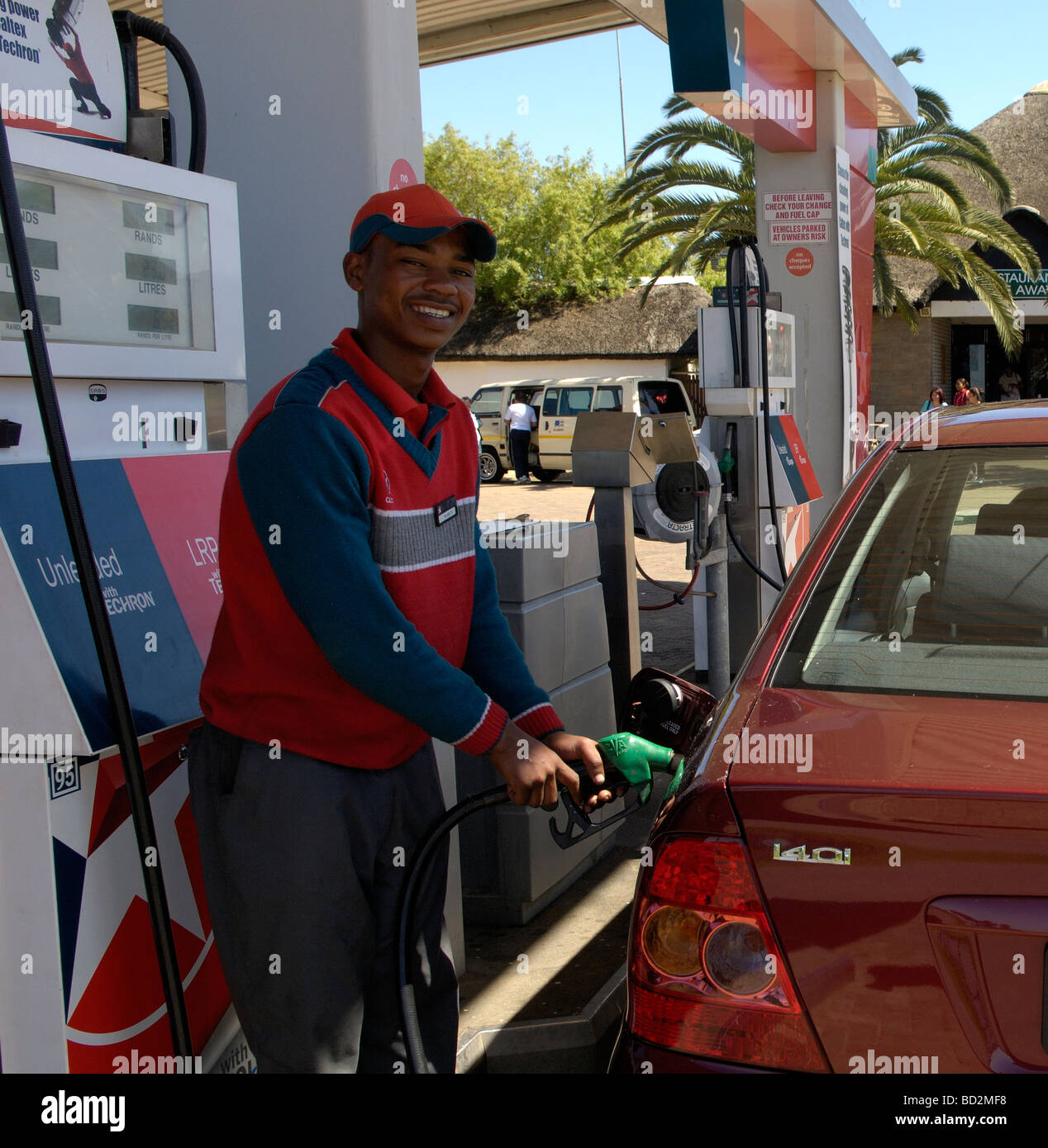 Garage attendant filling car with petrol, N2,Riversonderend, Overberg