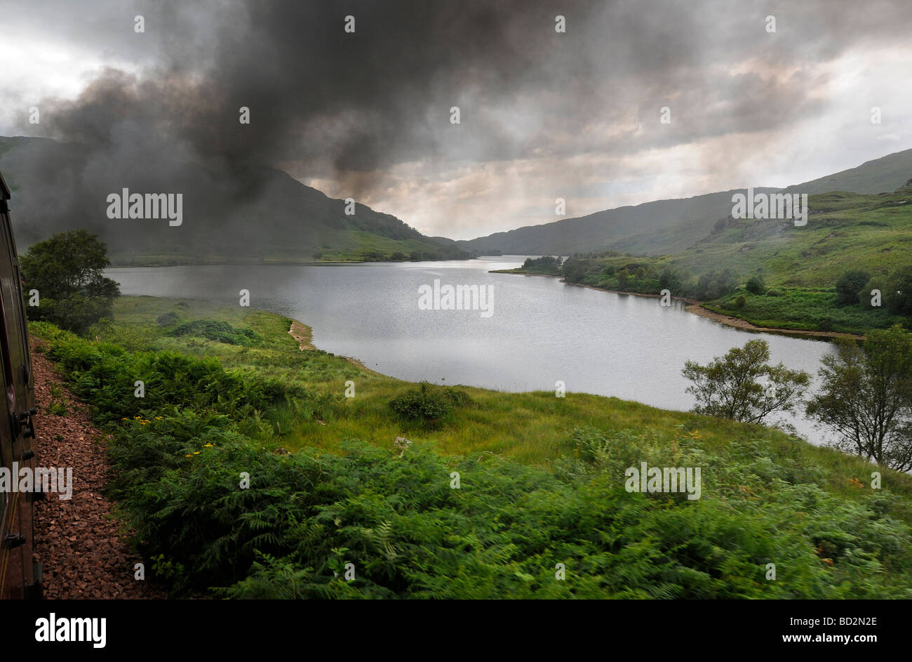 View over Loch Eilt during the Jacobite Steam train Journey from Fort William to Mallaig in Scotland Stock Photo