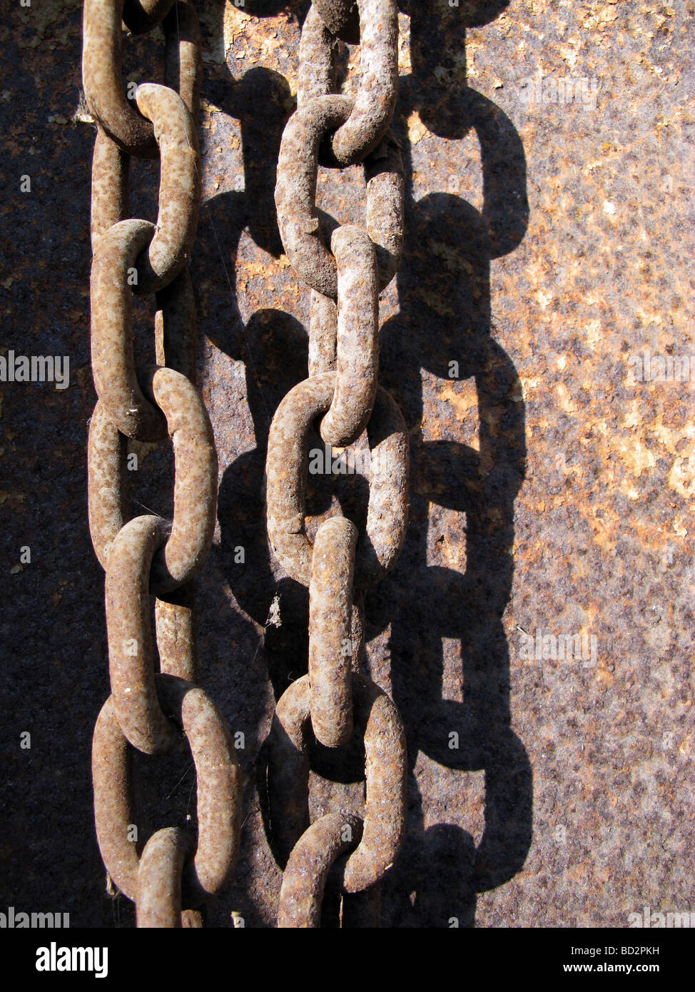 hanging chains on old rusty door by private property Stock Photo Alamy