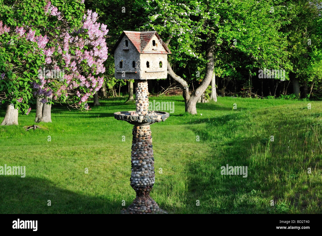 Stone Bird Feeder Outside The Grand Traverse Lighthouse Stock
