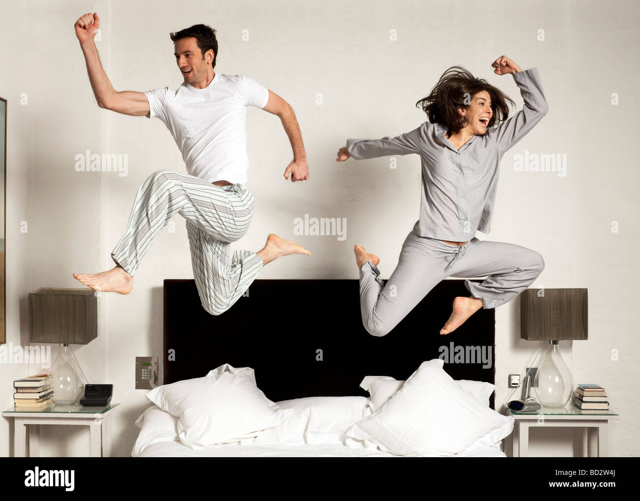 couple-leaping-out-of-bed-stock-photo-alamy