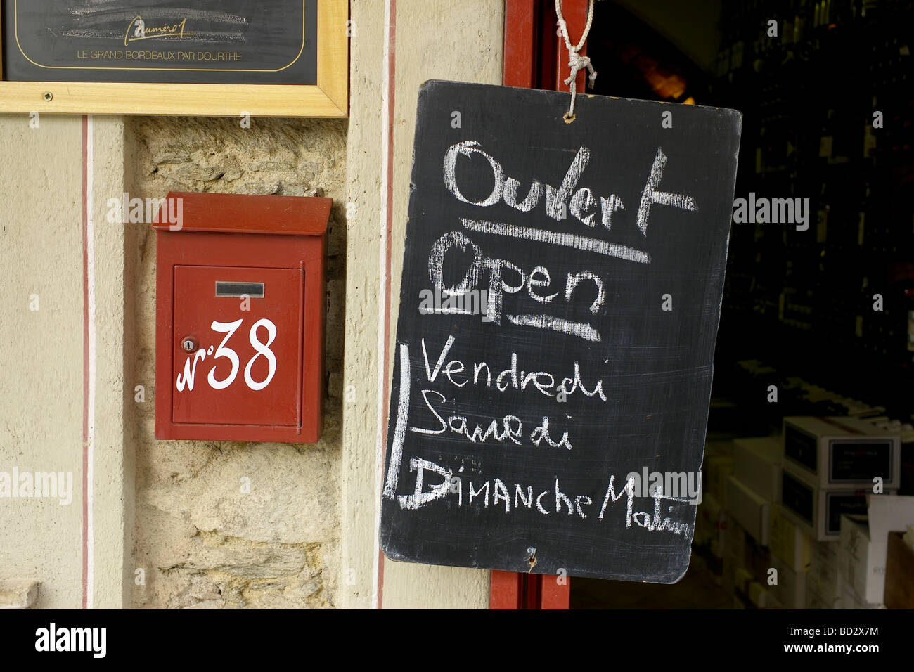 French village shop sign and post box Stock Photo