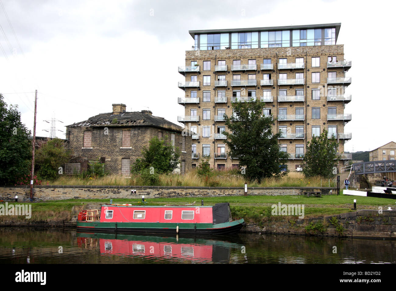 Millroyd Mill,renovated mill building overlooking derelict former pub and Brighouse Basin Stock