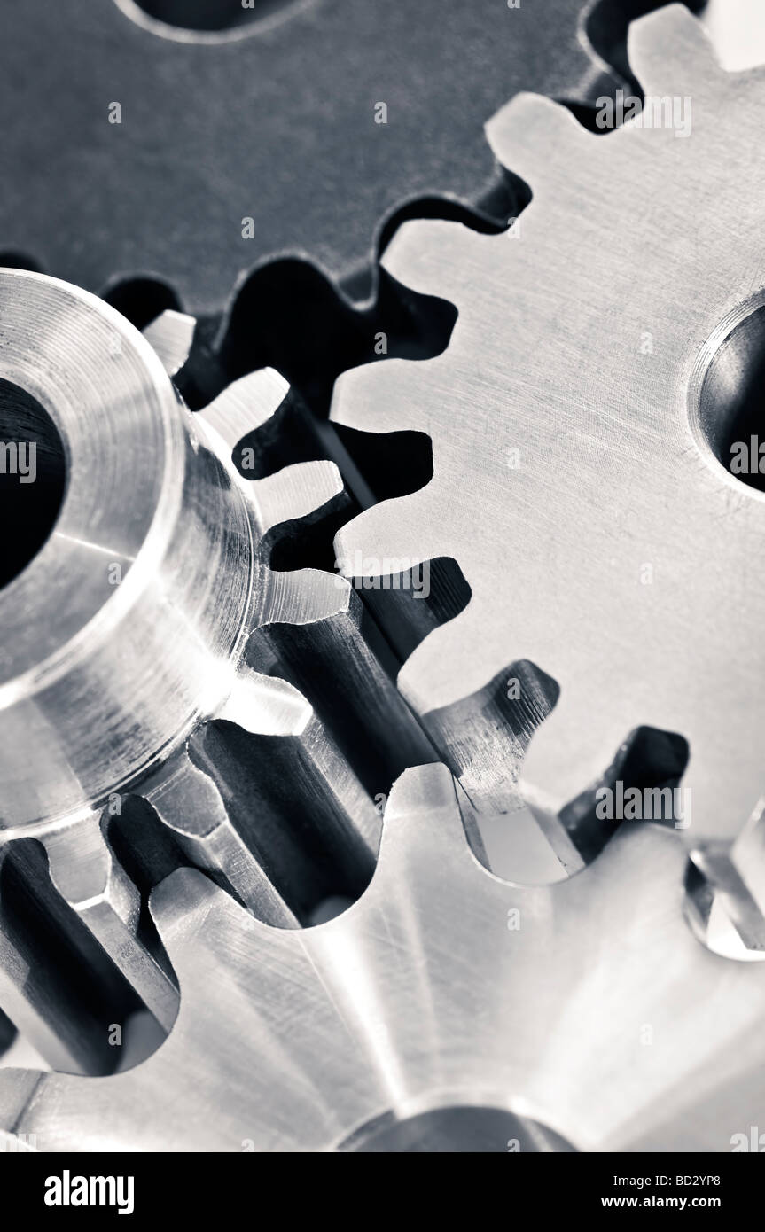 Industrial metal gears and machine parts connected Stock Photo