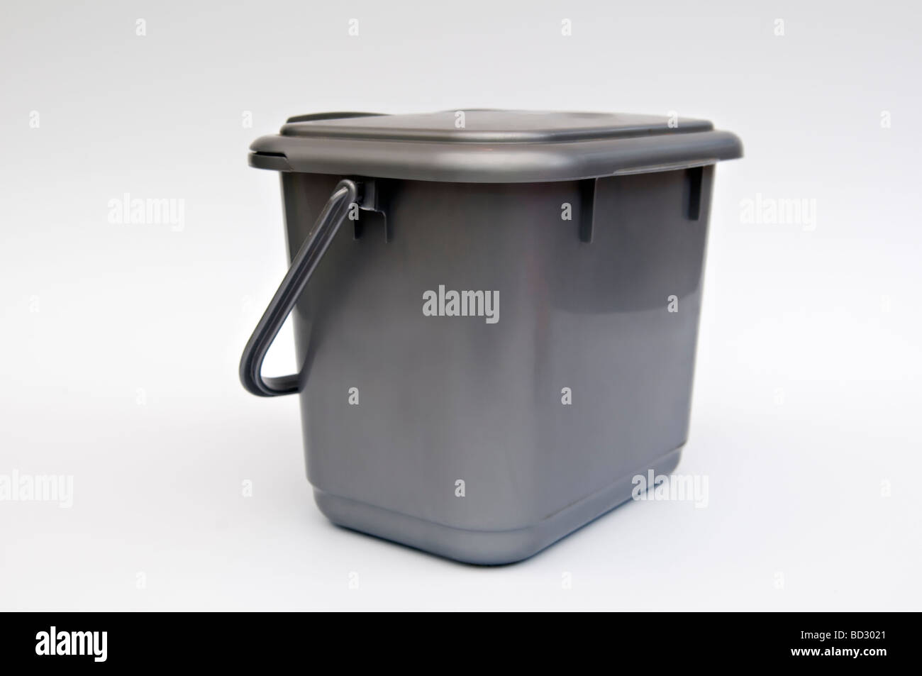 Kitchen compost caddy against white background Stock Photo
