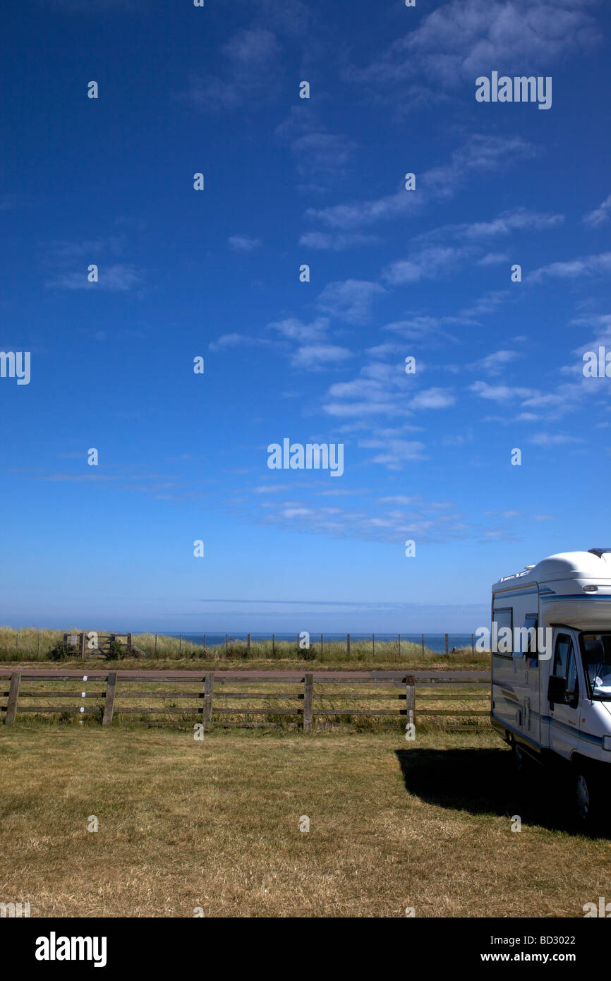 Motorhome at Beadnell Bay Camping and Caravanning Club site, Northumberland, Northeast England, UK Stock Photo