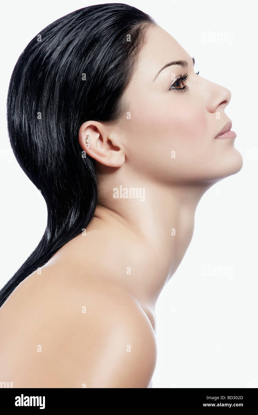 Dark-haired young woman in profile Stock Photo