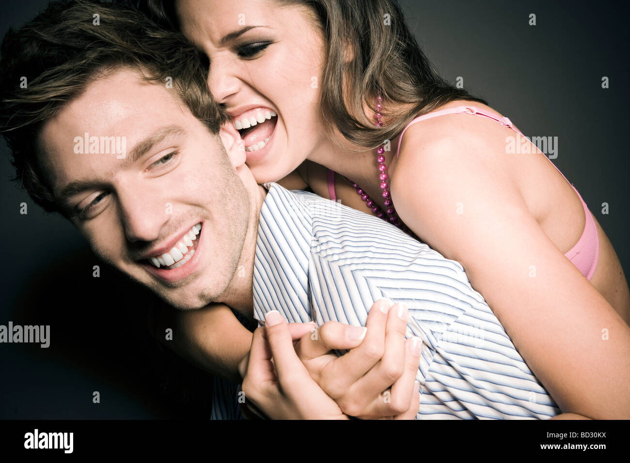 Woman Biting Mans Ear Stock Photo Alamy my-dog-is-constantly-nibbling-the-blankets-and-no-matter-how-much-we