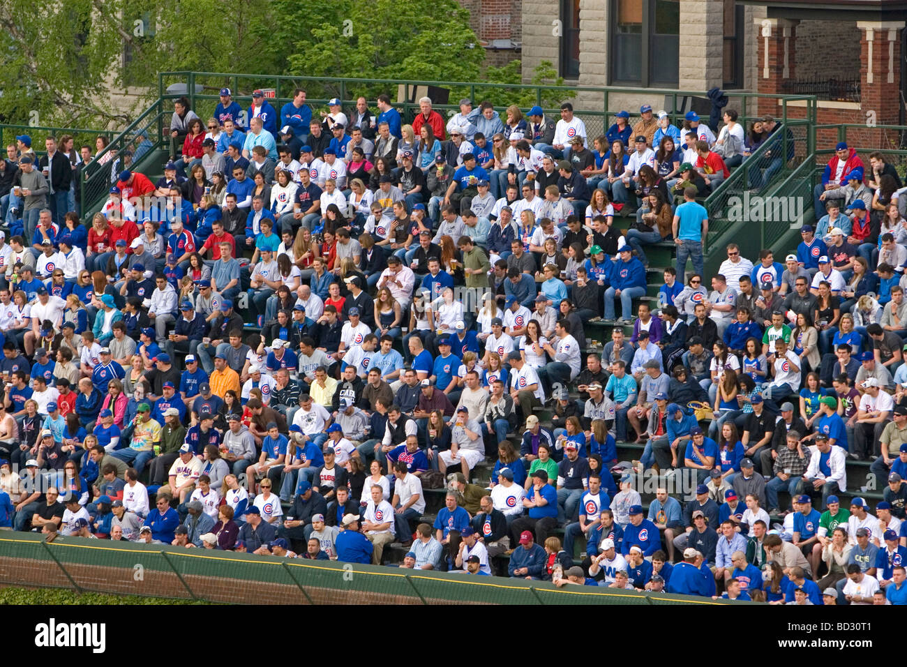 Fans in bleachers watch a Cubs baseball game at Wrigley Field in Chicago Illinois USA  Stock Photo