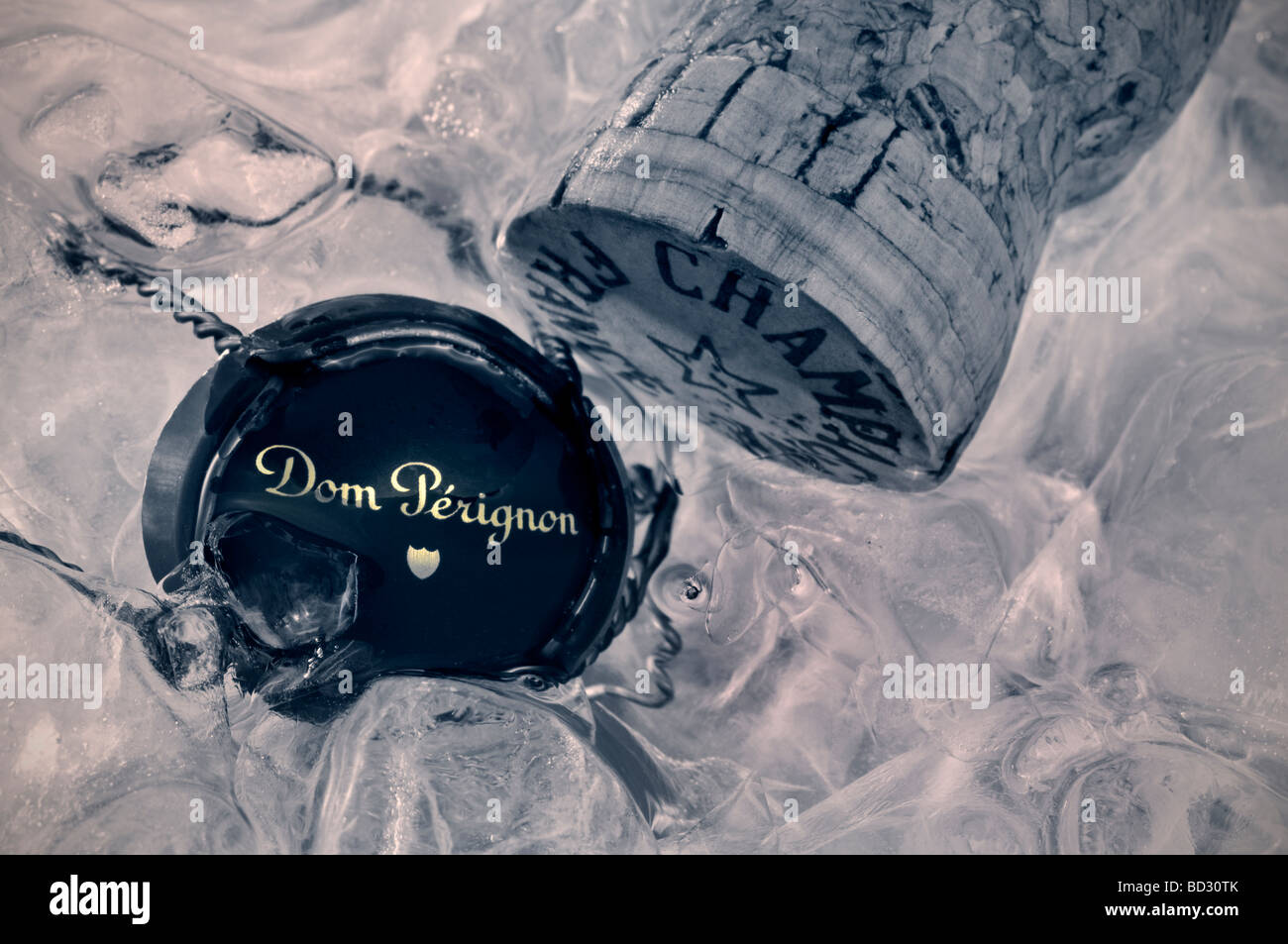 'Dom Perignon' vintage champagne cork and wire retaining frame and metal top cap in ice wine cooler Stock Photo