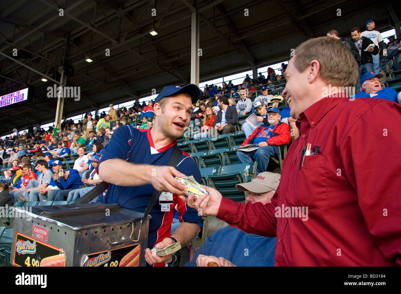 Vendor selling hot dogs during a Cubs baseball game at Wrigley Field in Chicago Illinois USA Stock Photo