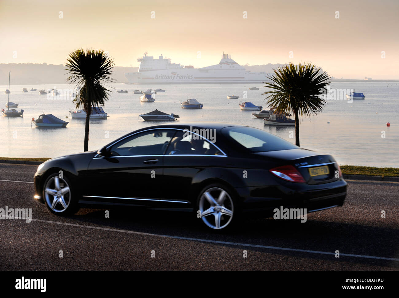 A Luxury Mercedes On Banks Road As A Brittany Ferries Ship Leaves