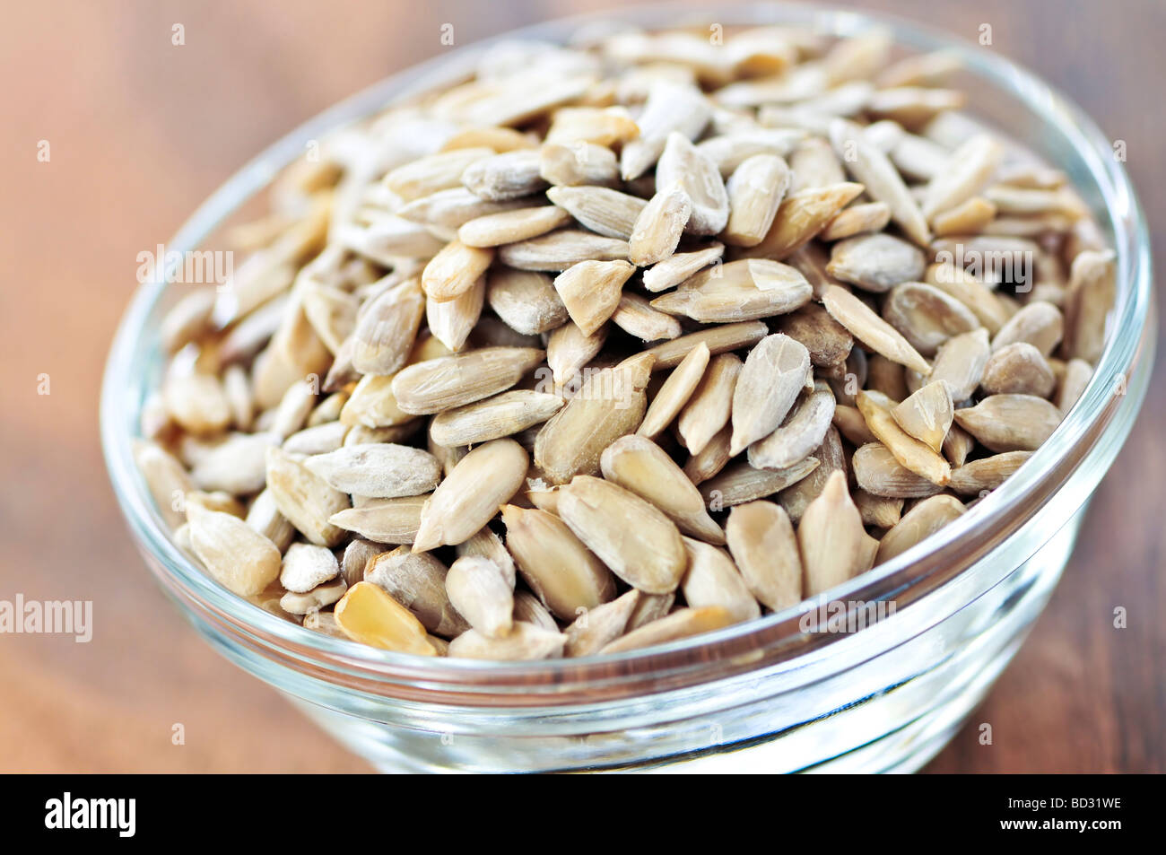 Shelled sunflower seeds close up in glass bowl Stock Photo