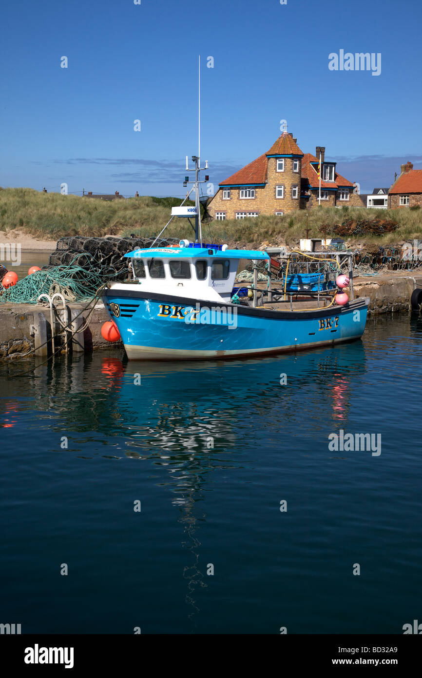 Boat at anchor in Beadnell Harbour, Northumberland, Northeast England, UK Stock Photo