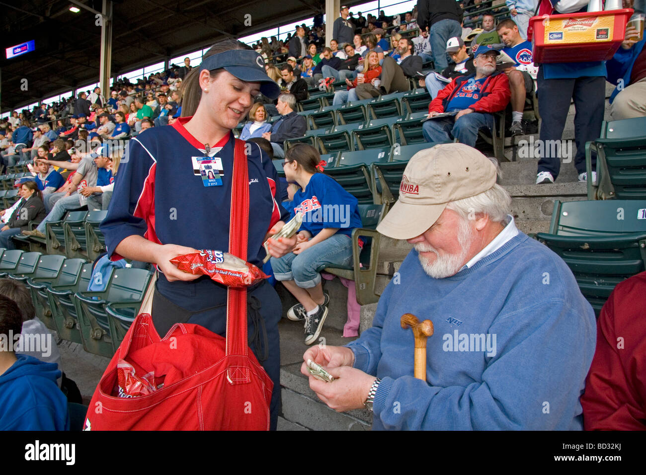 Female vendor selling peanuts during a Cubs baseball game at Wrigley