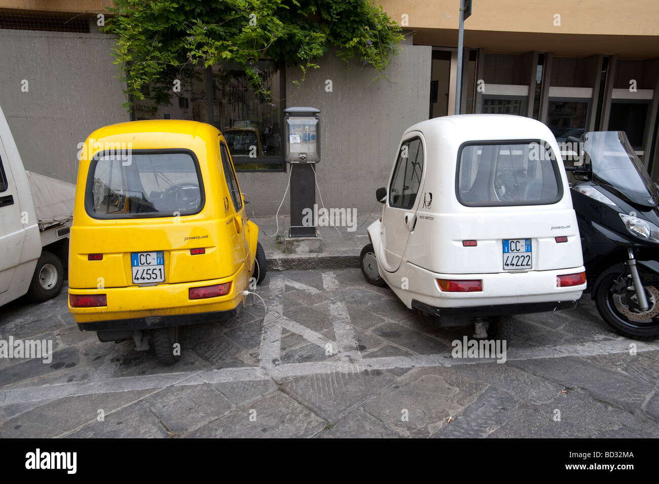 Two three wheel bubble cars parked on Italian street Stock Photo
