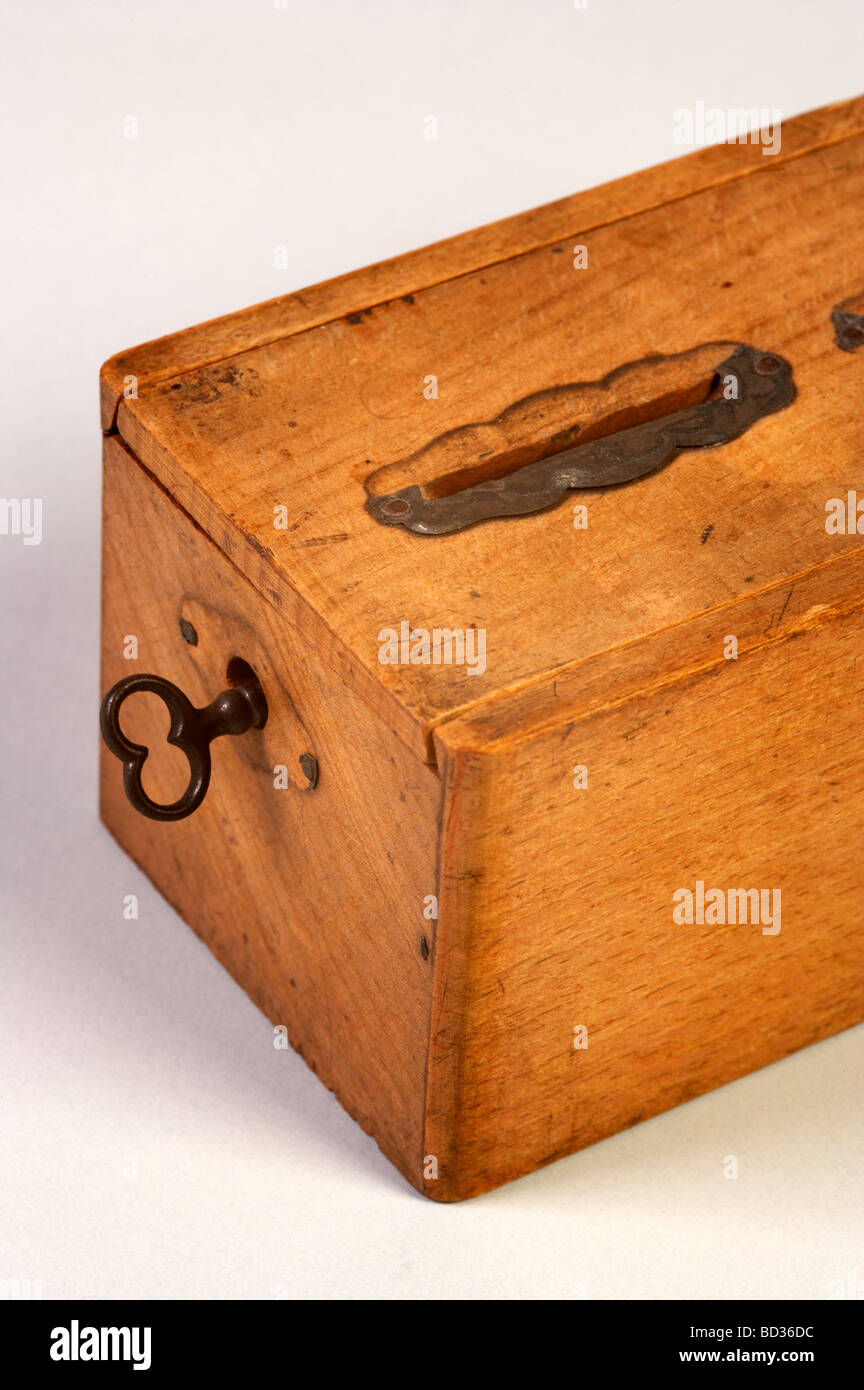Old money box with key Stock Photo Alamy