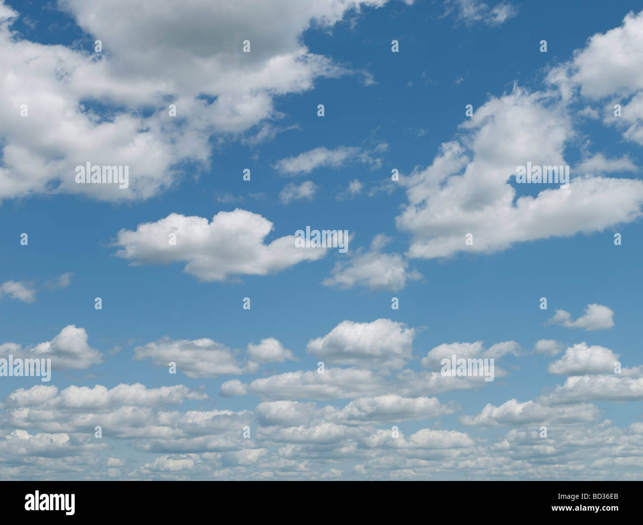 Blue sky puffy clouds Stock Photo