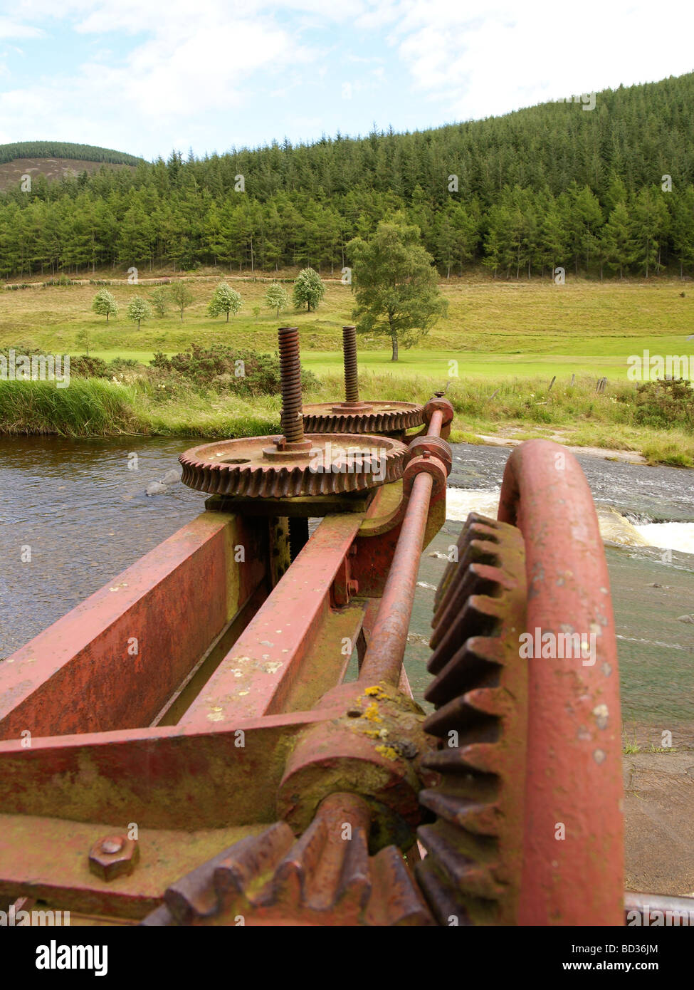 Gears for opening the sluice gates at the dam on the Leithen Water above Innerleithen, Borders Region Scotland Stock Photo