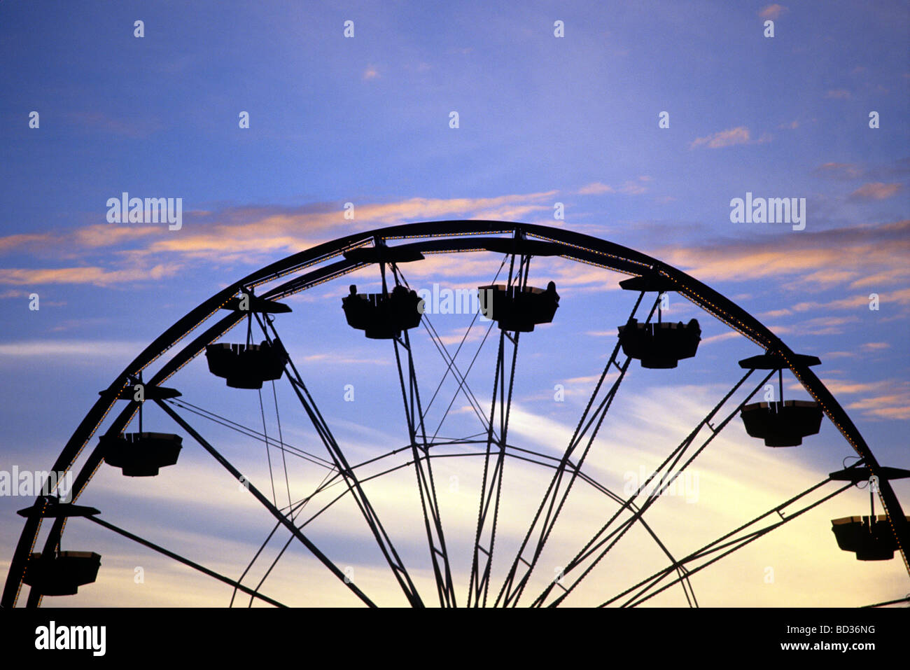 Ferris Wheel and Sunset Sky Stock Photo