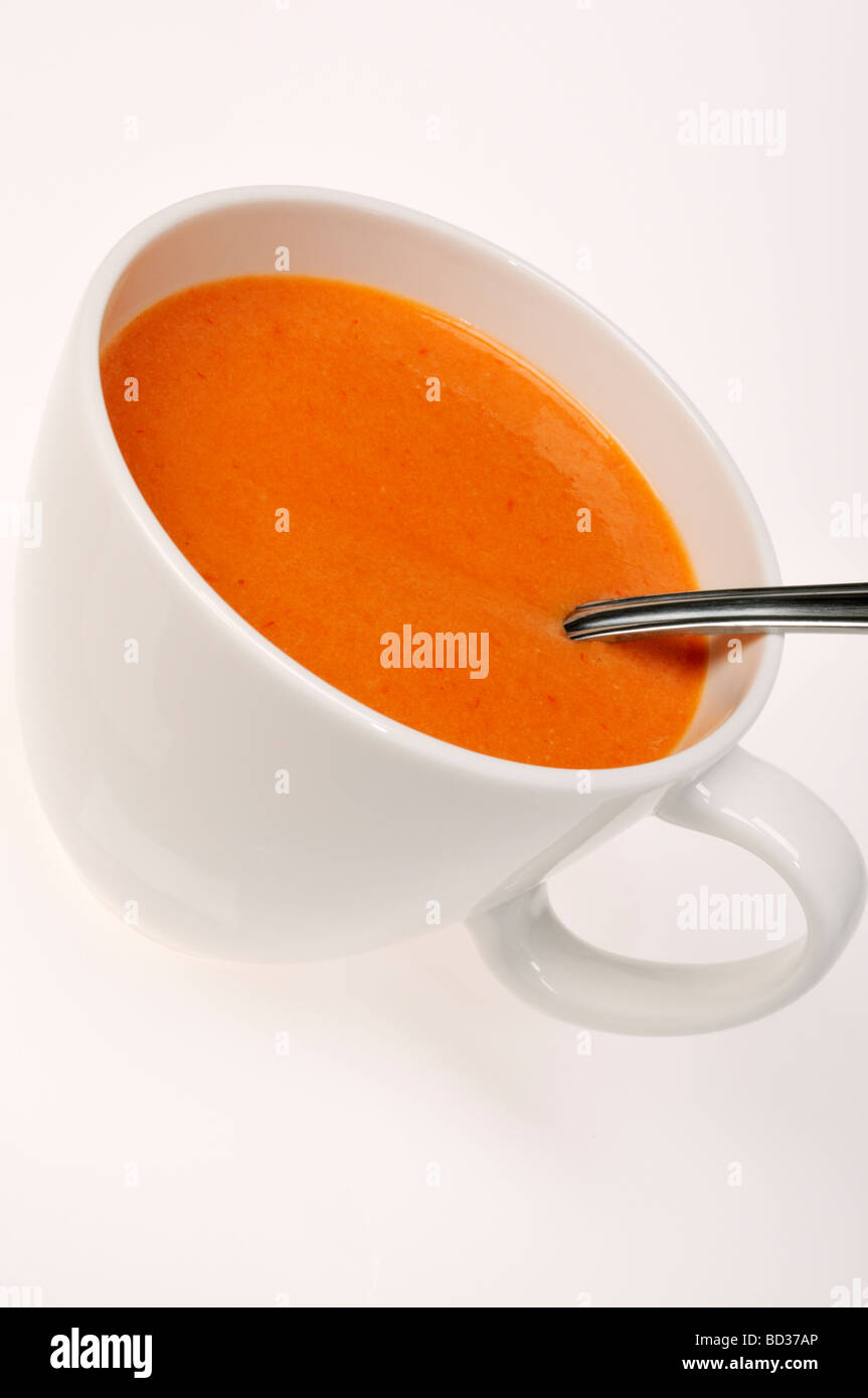 Cup of tomato soup with spoon Stock Photo