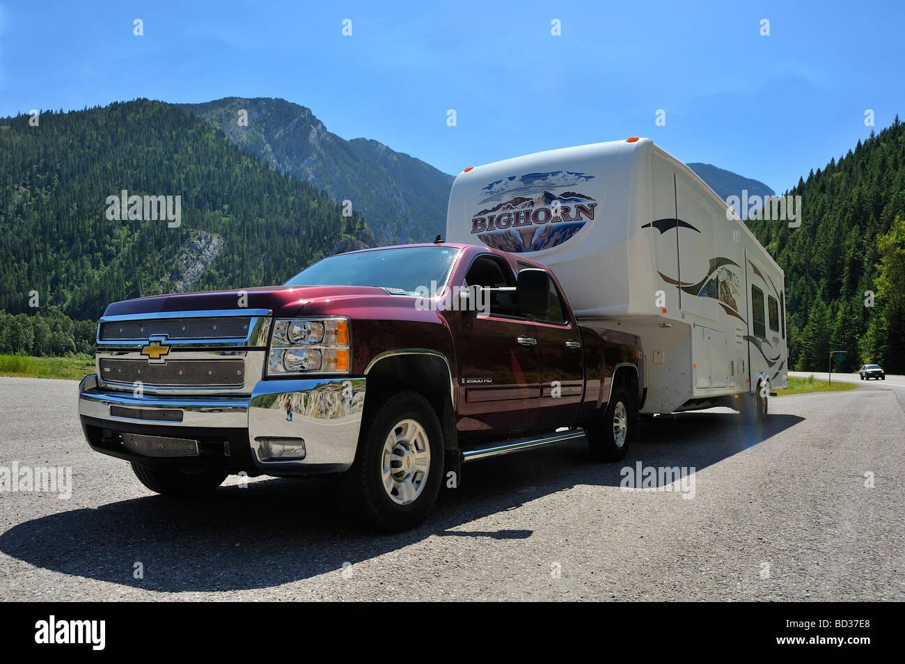 Pick up truck and camper in the mountains Stock Photo