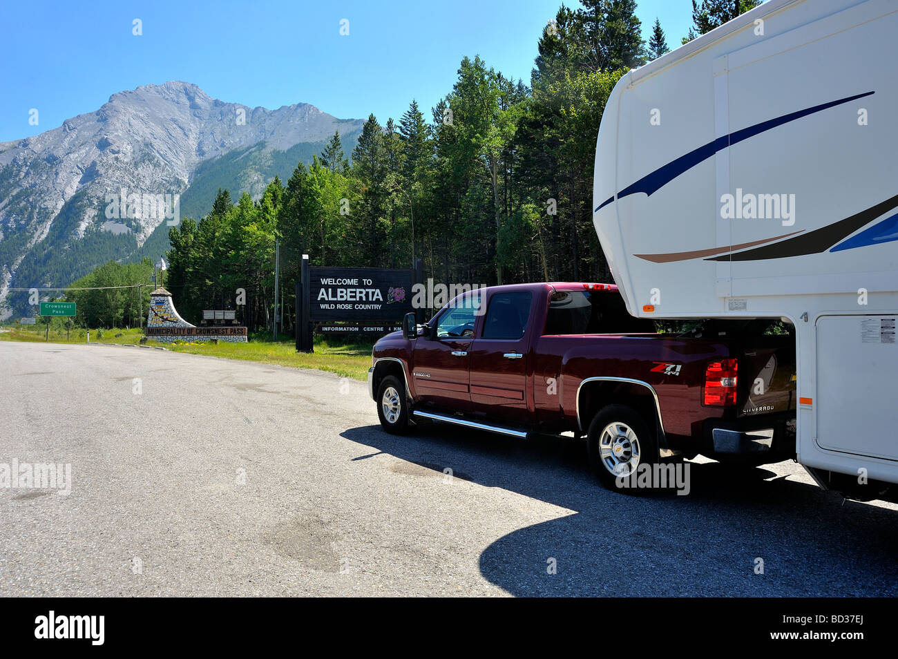 A pickup truck with a camper at a rest stop on the Crows Nest Pass in southern Alberta Canada Stock Photo