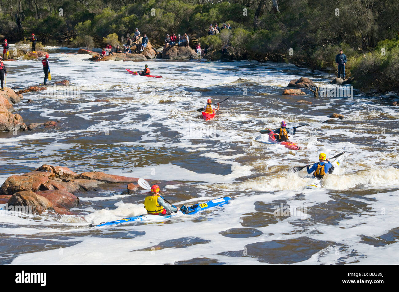 Kayakers shooting the rapids below the Lower Swan BRidge in the annual West Australian whitewater classic the Avon Descent Stock Photo