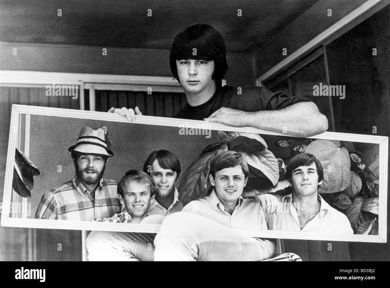 BEACH BOYS  - Brian Wilson holds a framed photo of the group US pop group Stock Photo