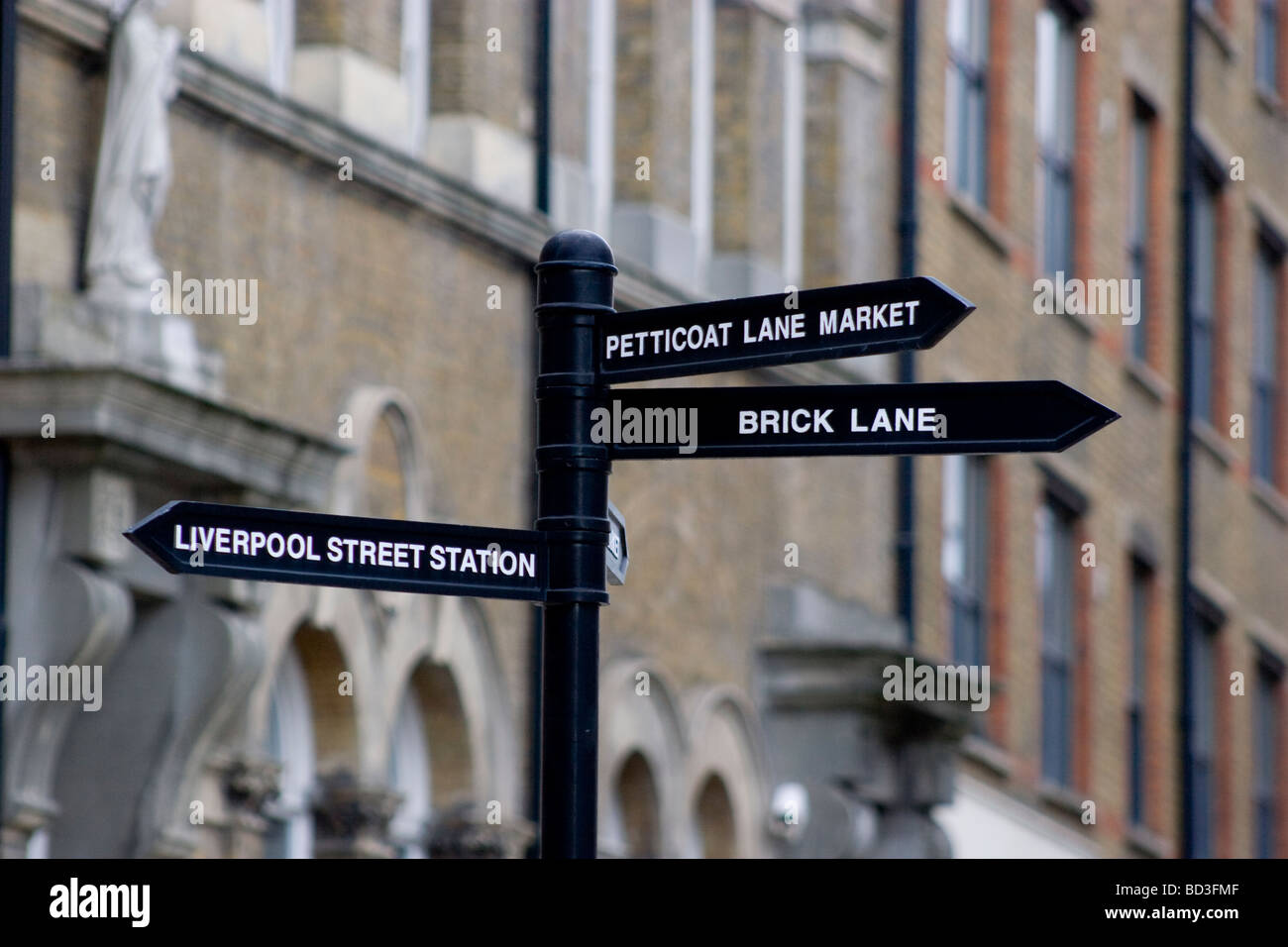 street sign brick lane with petticoat lane brick lane and liverpool street station indicated Stock Photo