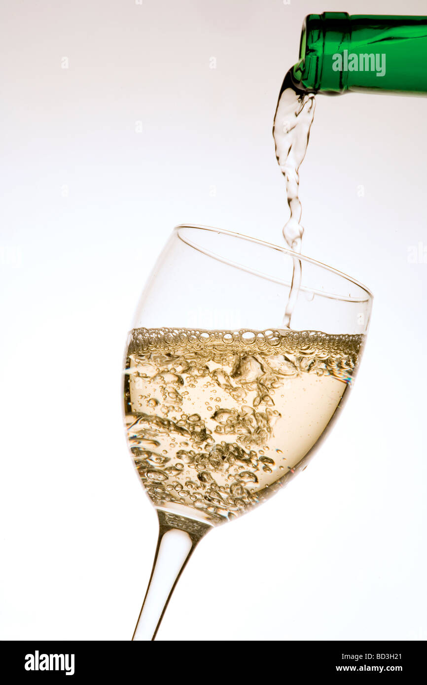 serving white wine in a glass Stock Photo