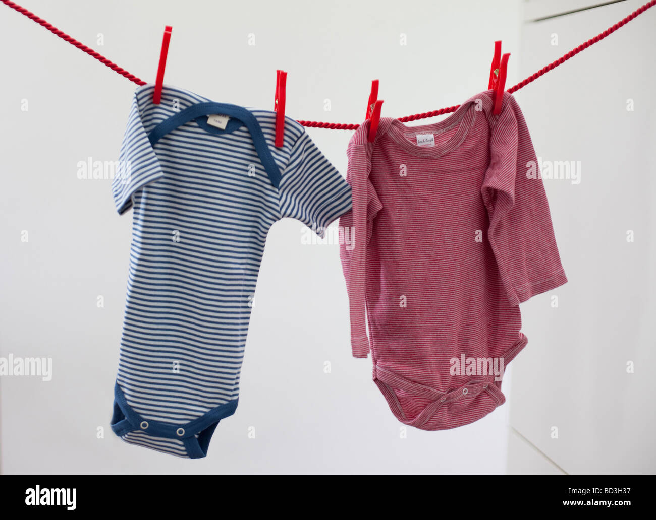 Clothesline with Baby clothing Stock Photo