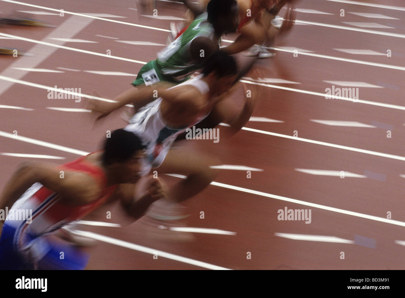 Blurred action of start of men s 100 meter sprints race Stock Photo