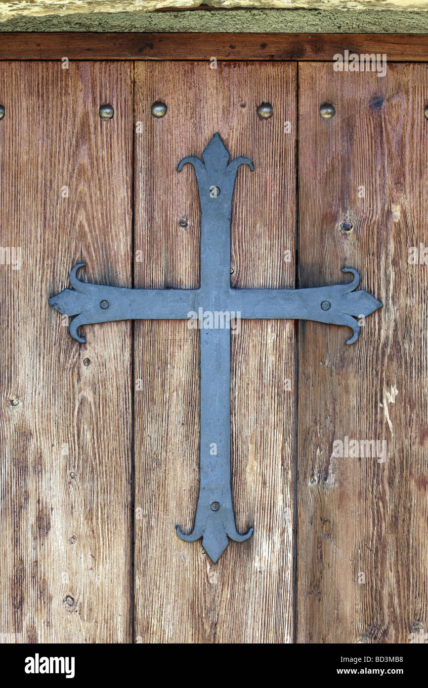 Cross on the Door of the Church of Santa Ana Near the Village of Torla in the Pyrenees Mountains Spain Stock Photo