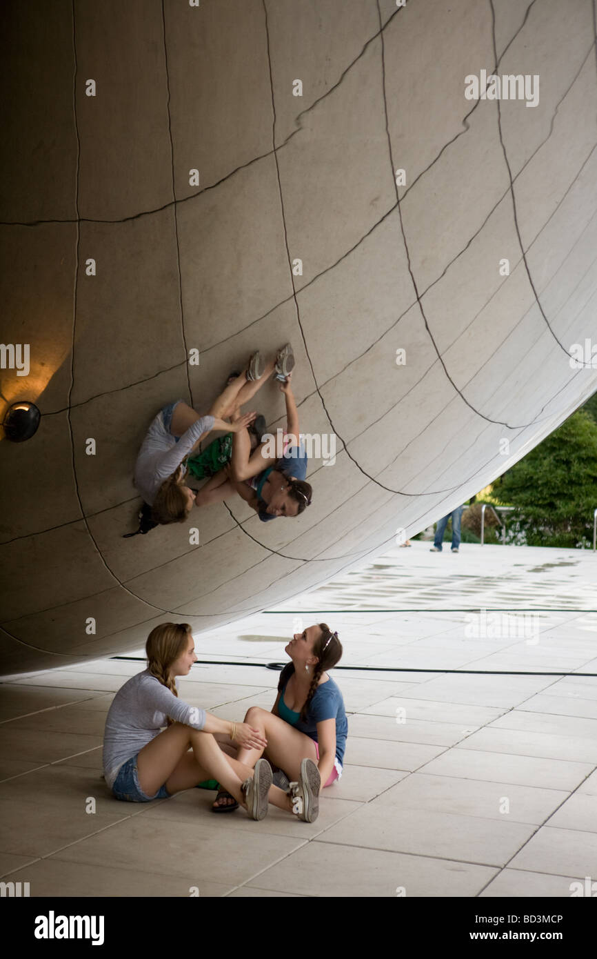 Two friends enjoy Anish Kapoor sculpture Cloud Gate aka the Bean in ...