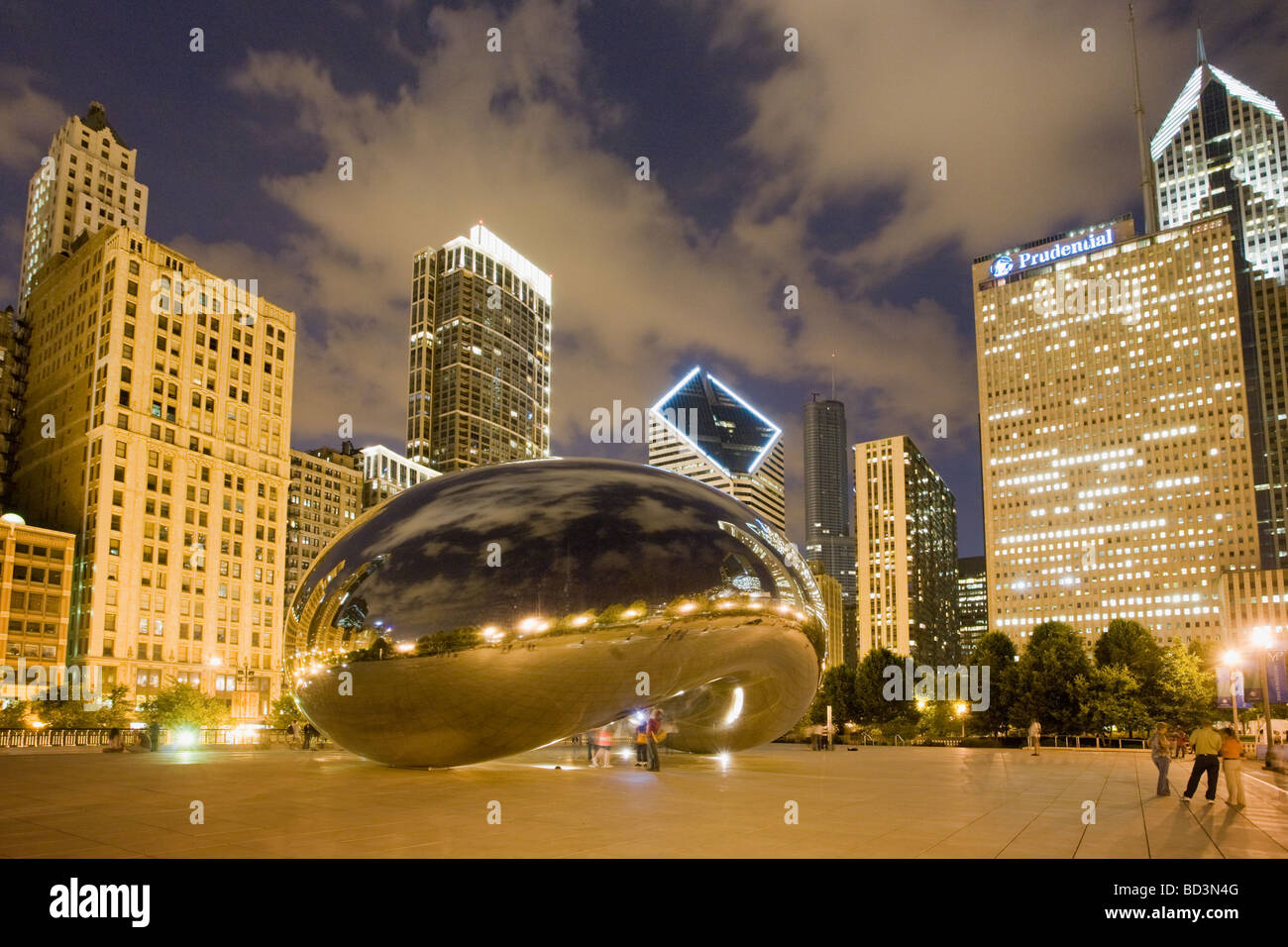 Anish Kapoor sculpture Cloud Gate aka the Bean at night with city