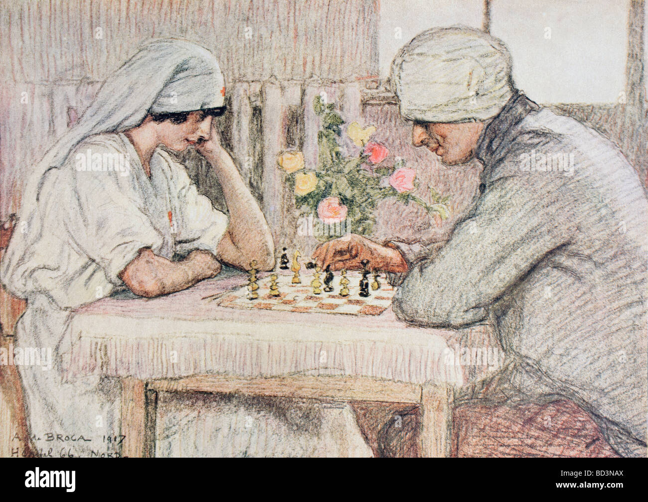 A nurse plays chess with a wounded soldier. Stock Photo