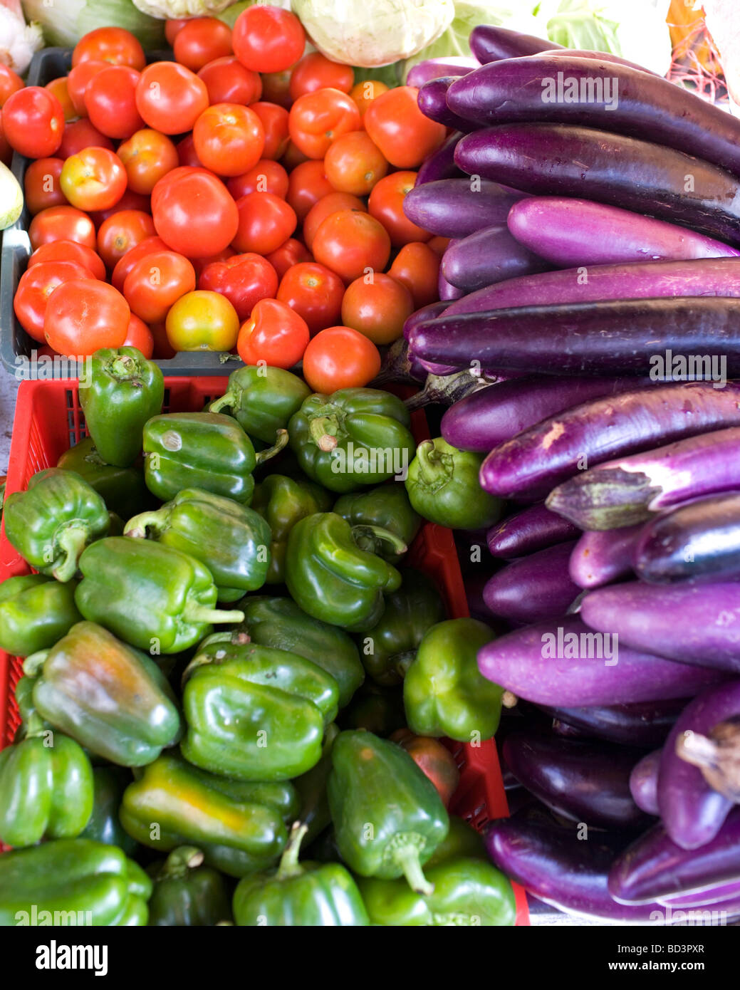 Selection of tomatoes, green pepper and brinjals sold in Pudu Market in Kuala Lumpur, Malaysia Stock Photo