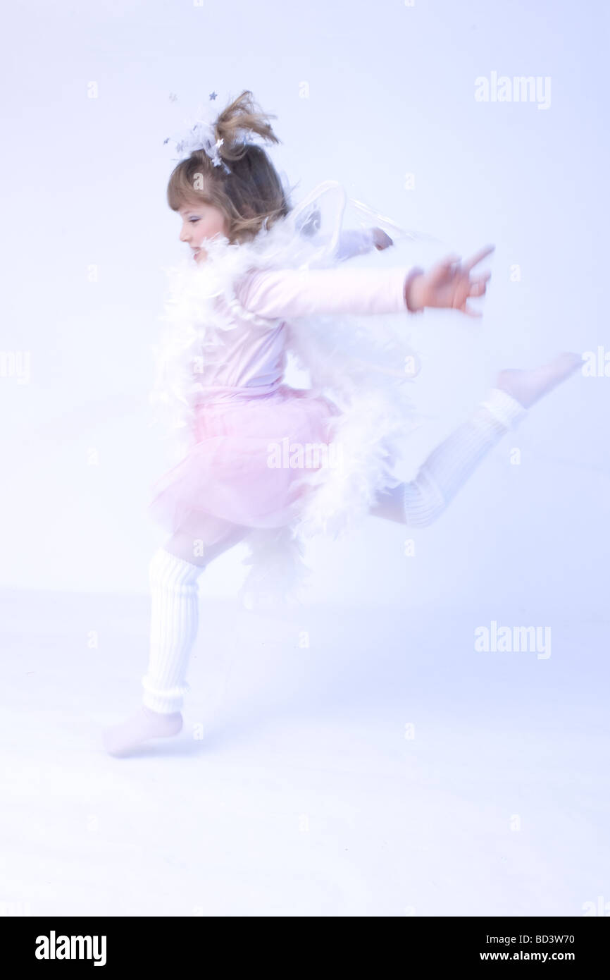 Cute little fairy holding wand and smiling Stock Photo Alamy