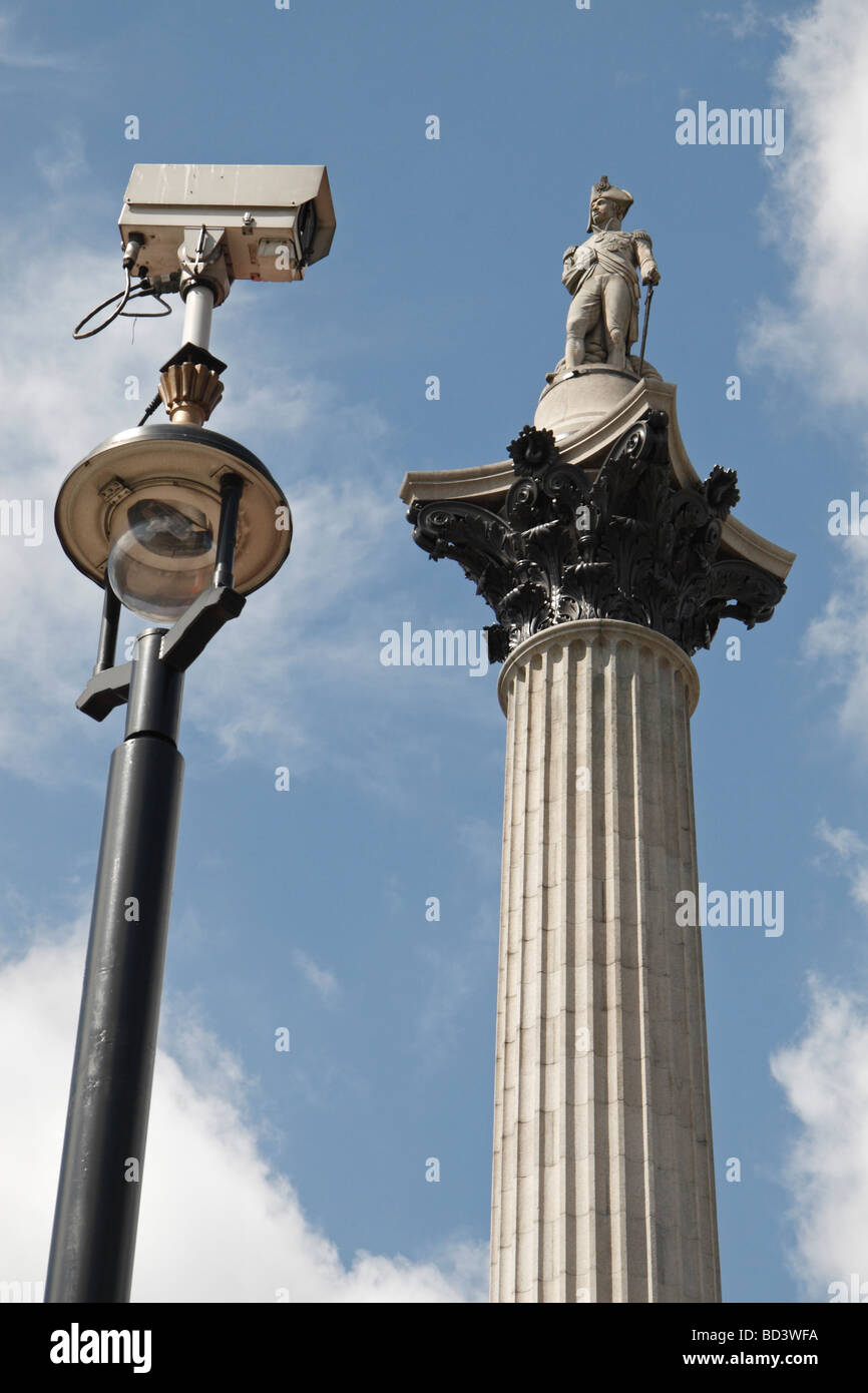 Big Brother is watching!  A CCTV video camera looking Lord Nelson in the eye (Nelsons Column) in Trafalgar Square, London, UK. Stock Photo